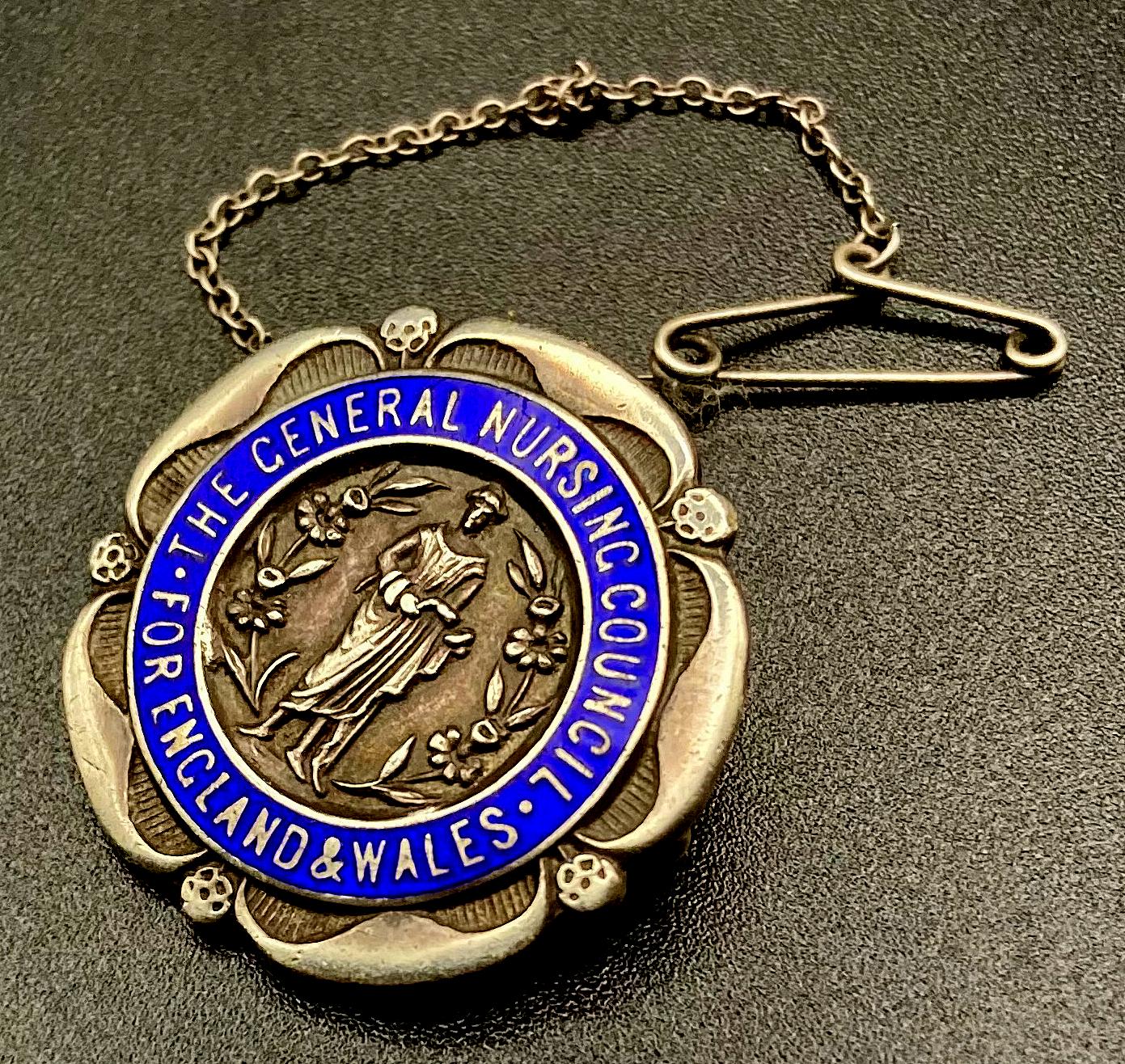 Other angled view of The General Nursing Council for England and Wales badge presented to M.B. Lethem 1922