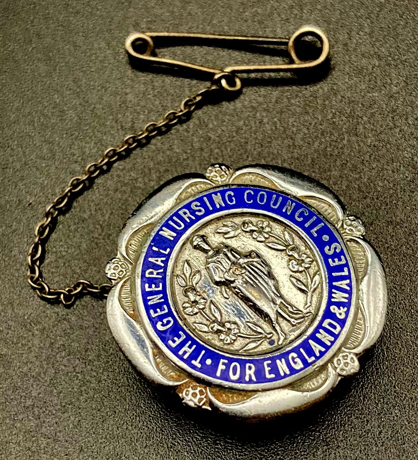 Angled view of The General Nursing Council for England and Wales badge presented to E.E. Webb 1943
