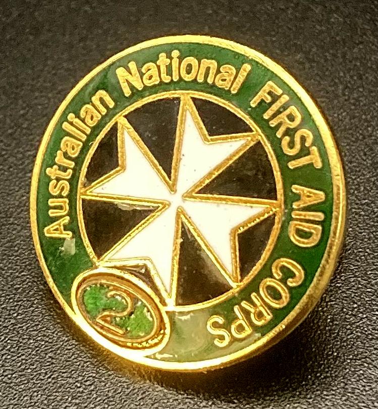 Other angled view of Australian National First Aid Corps enamel badge