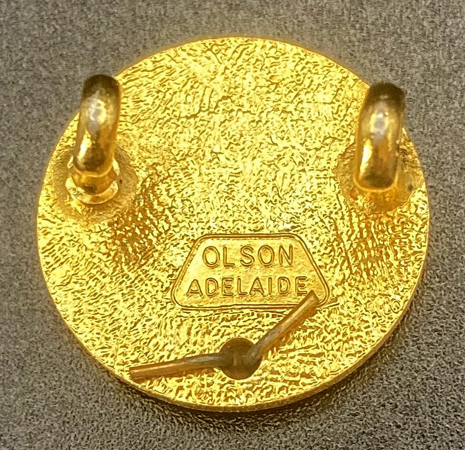 Reverse of Australian National First Aid Corps enamel badge