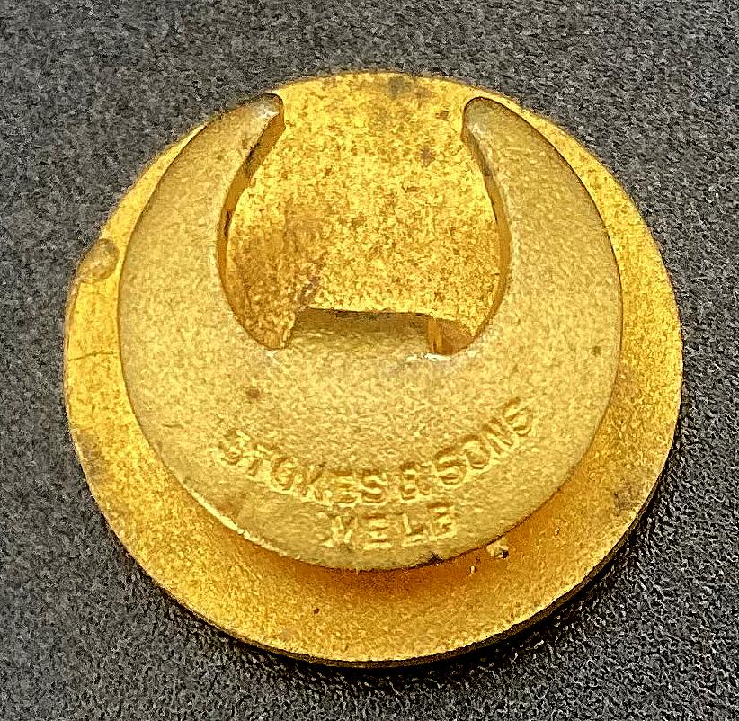 Reverse of Zinc Corporation Ambulance Association enamel badge