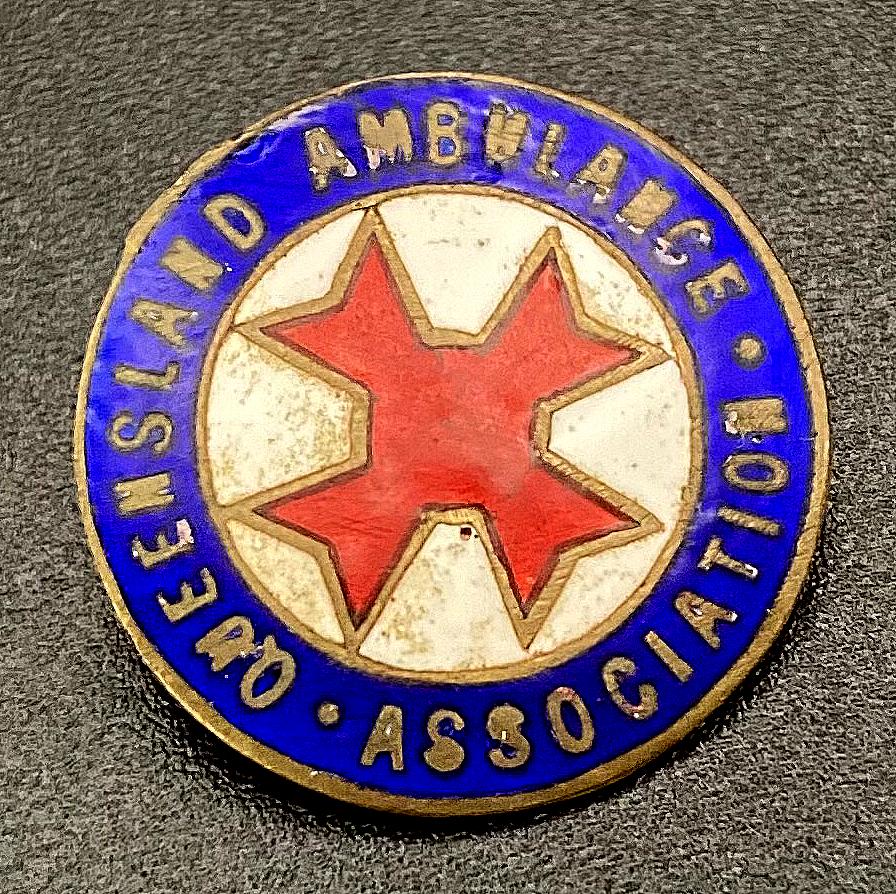 Angled view of Queensland Ambulance Association enamel badge
