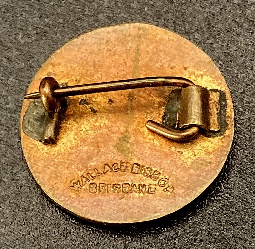 Reverse of Queensland Ambulance Association enamel badge