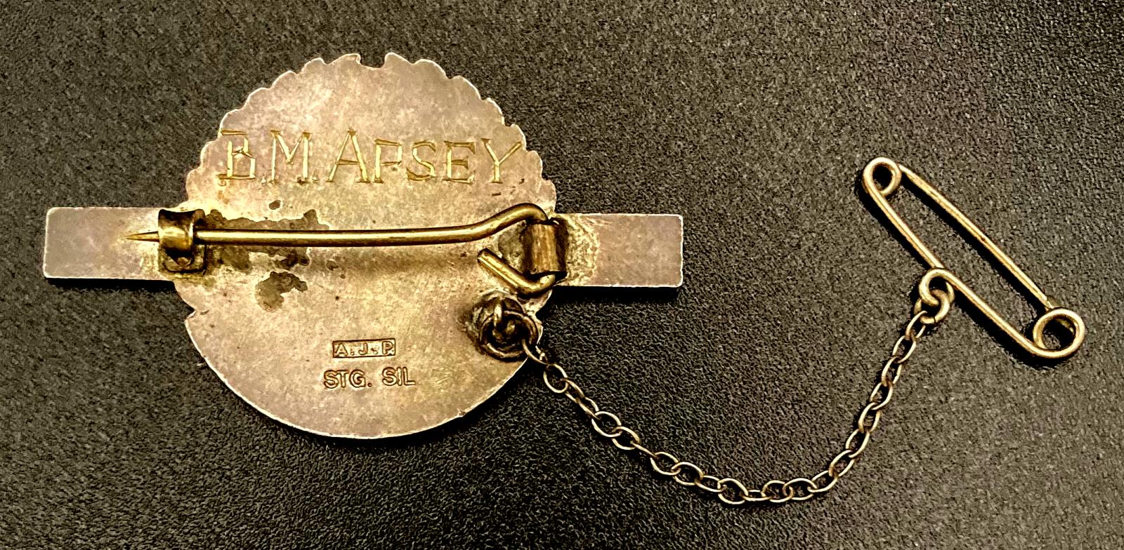Reverse of Queensland Ambulance Transport Brigade meritorious service badge