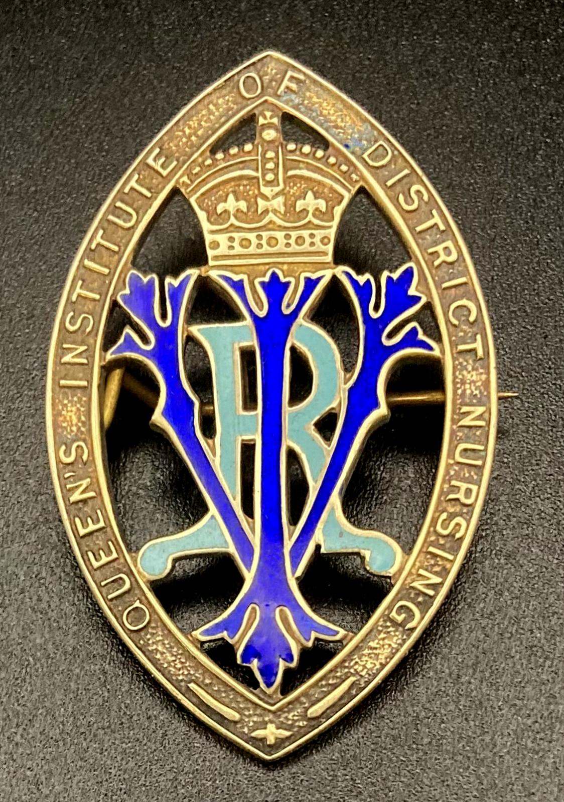 Queen's Institute of District Nursing badge presented to Winifred L. Bingham