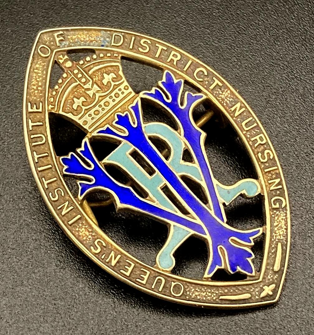 Angled view of Queen's Institute of District Nursing badge presented to Winifred L. Bingham
