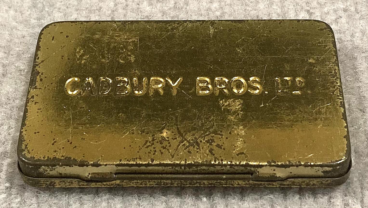 Oblique view of underside of souvenir chocolate tin - Coronation of King Edward VII and Queen Alexandra (1902)