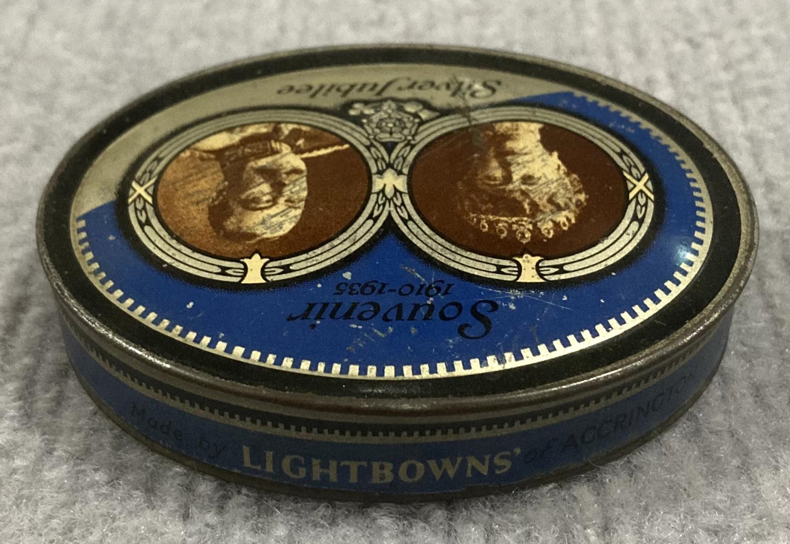 Oblique view from back of souvenir tin - Silver Jubilee of King George V and Queen Mary (1910–1935)