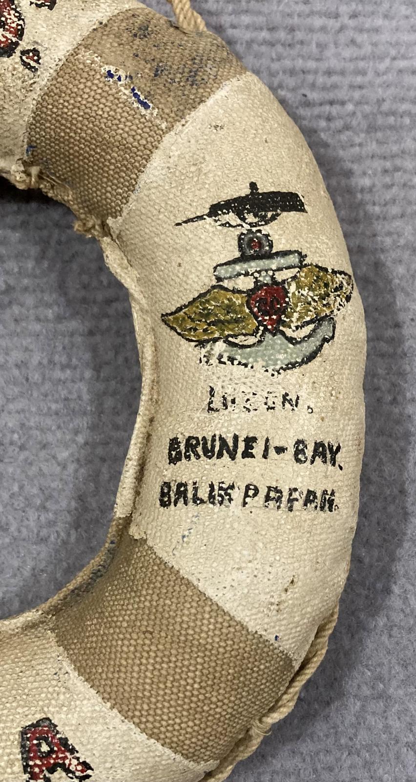 Close up of writing on right side of souvenir miniature naval lifebuoy - HMAS Kanimbla - 2
