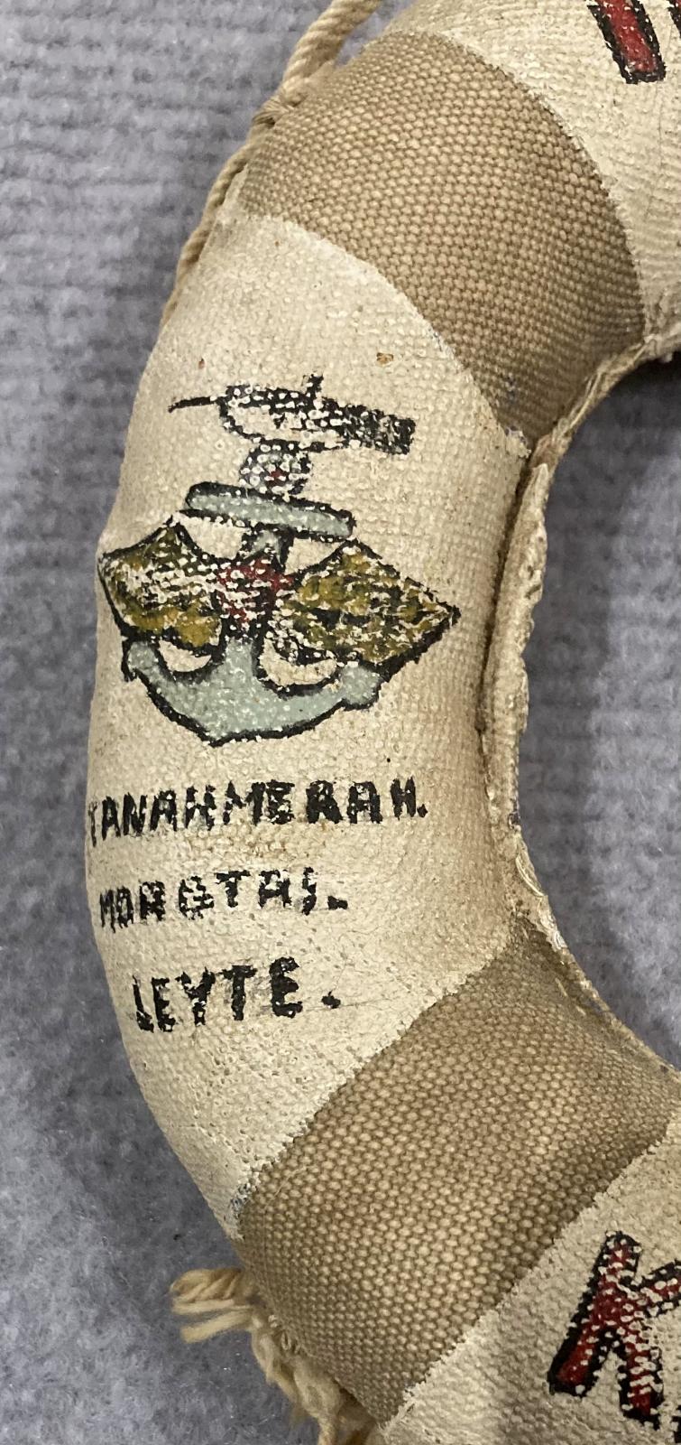 Close up of writing on left side of souvenir miniature naval lifebuoy - HMAS Kanimbla - 2