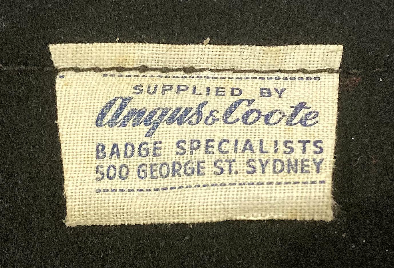 Close up of tag on reverse of souvenir felt pennant  - TSMV Manunda