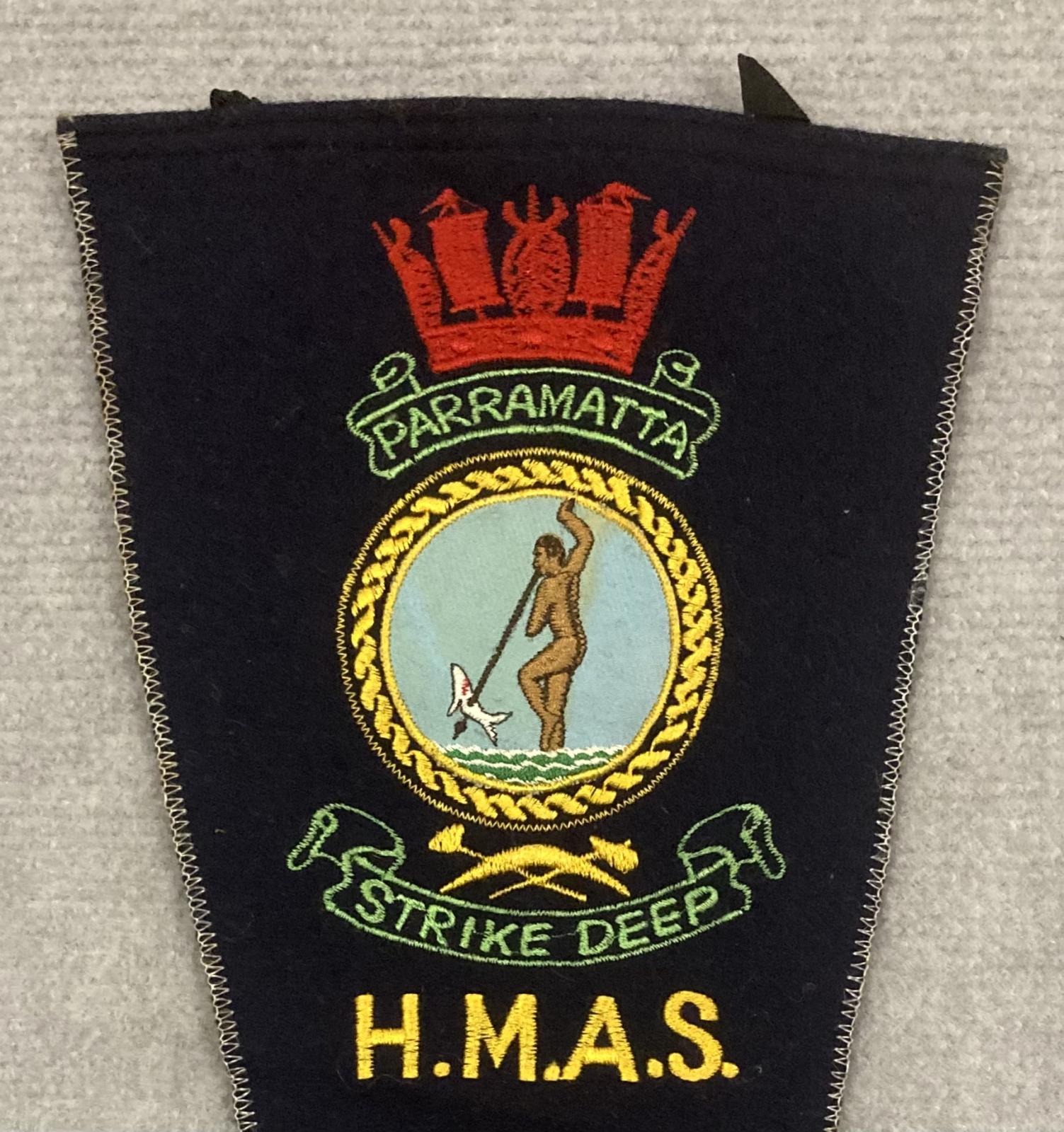 Close up of upper section of souvenir felt naval pennant - HMAS Parramatta