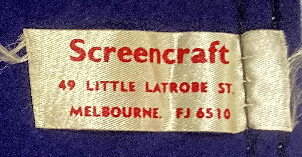 Close up of tag on reverse of souvenir felt naval pennant - HMAS Cerberus - 2