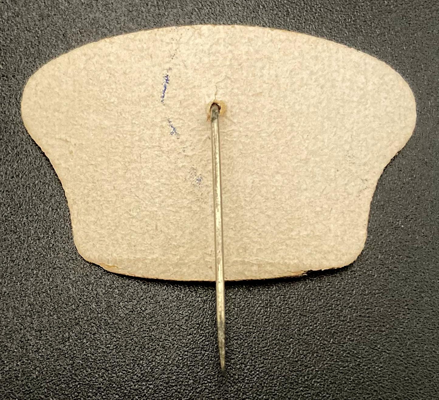 Reverse of ANZAC Day 1943 celluloid fundraising pin