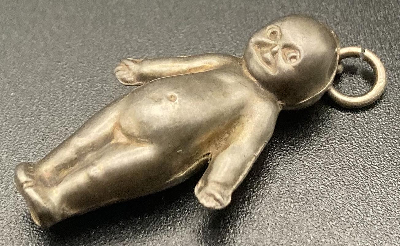 Other angled view of sterling silver Fums Up good luck charm