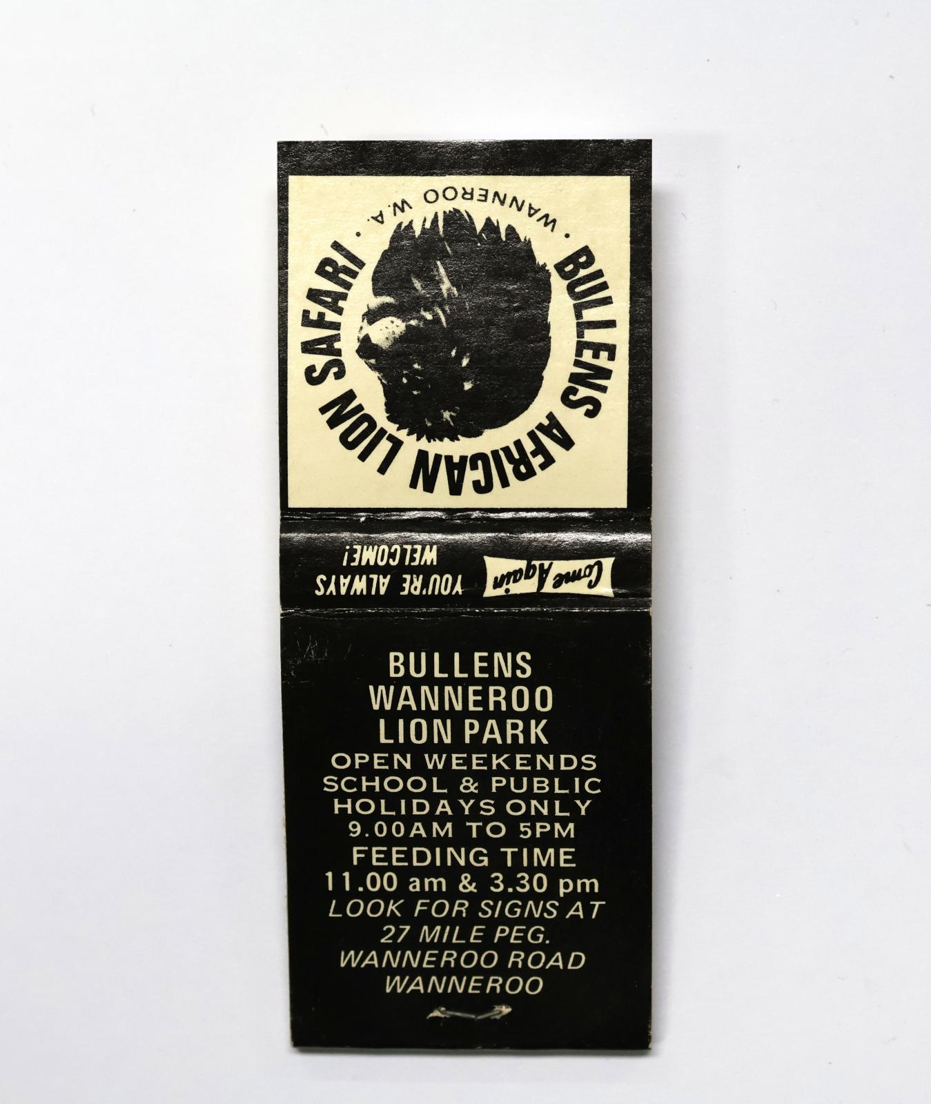 Rectangular shaped matchbook with black and white background with black text. The front of the matchbook has an image of a lion and a grey igniting panel. 