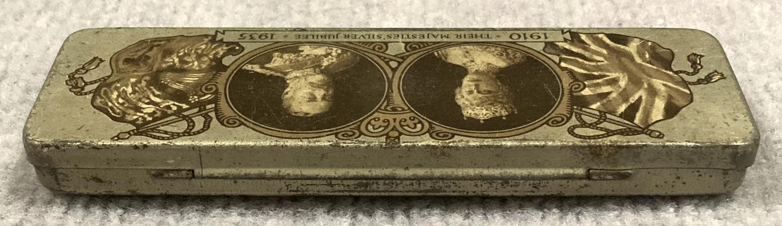 Oblique view from back of commemorative confectionary tin - Silver Jubilee of King George V and Queen Mary (1910–1935)