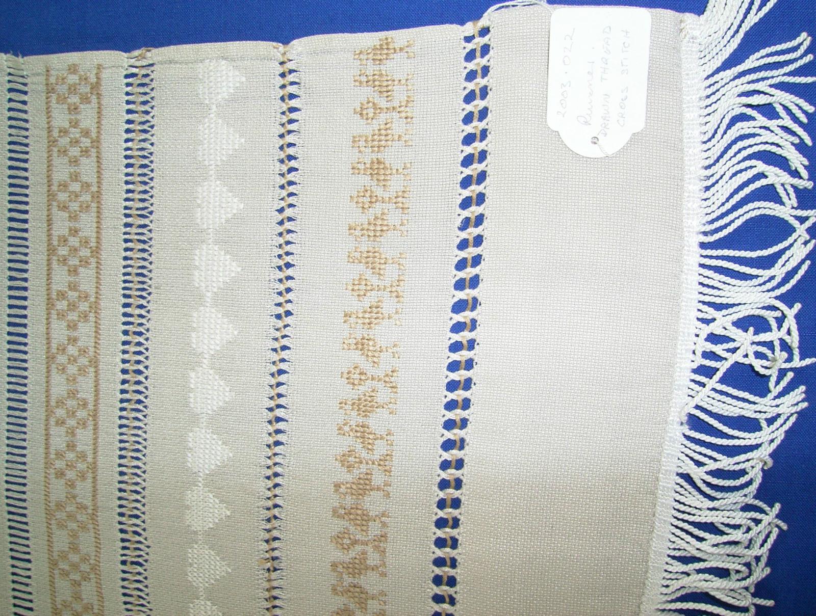Runner with embroidery and drawn thread