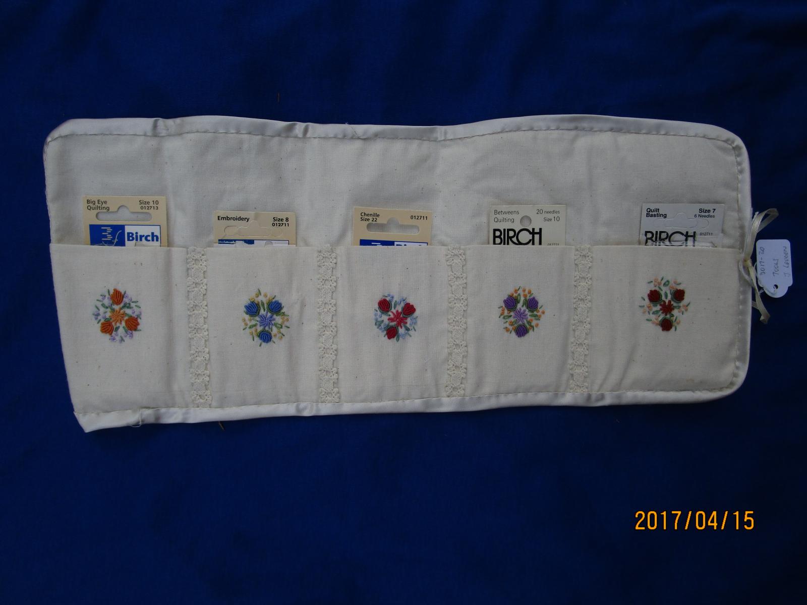 Embroidered needlecase open