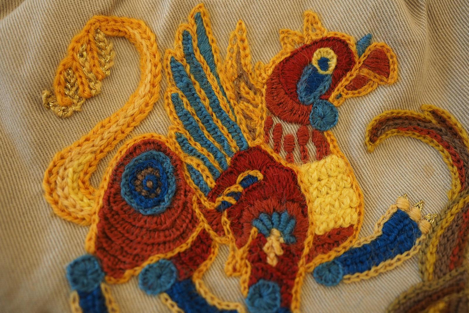 Closeup of Gryphon on crewel work bag