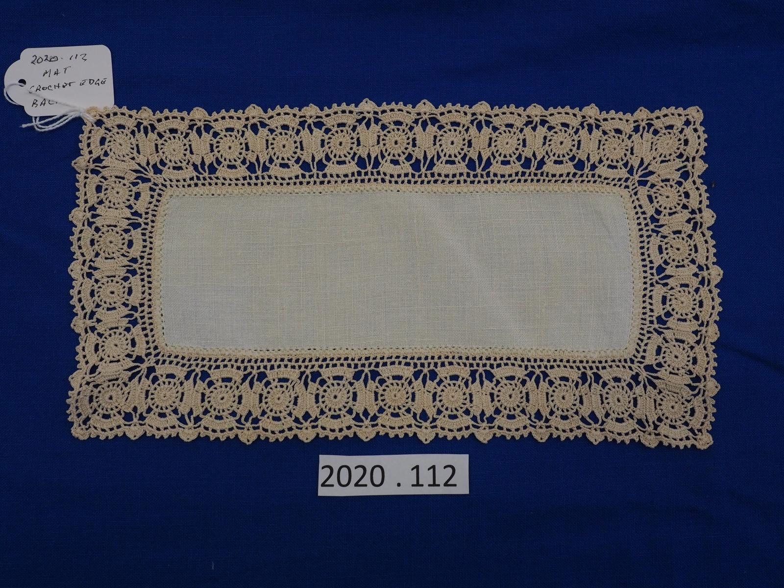 Mat with crocheted edge