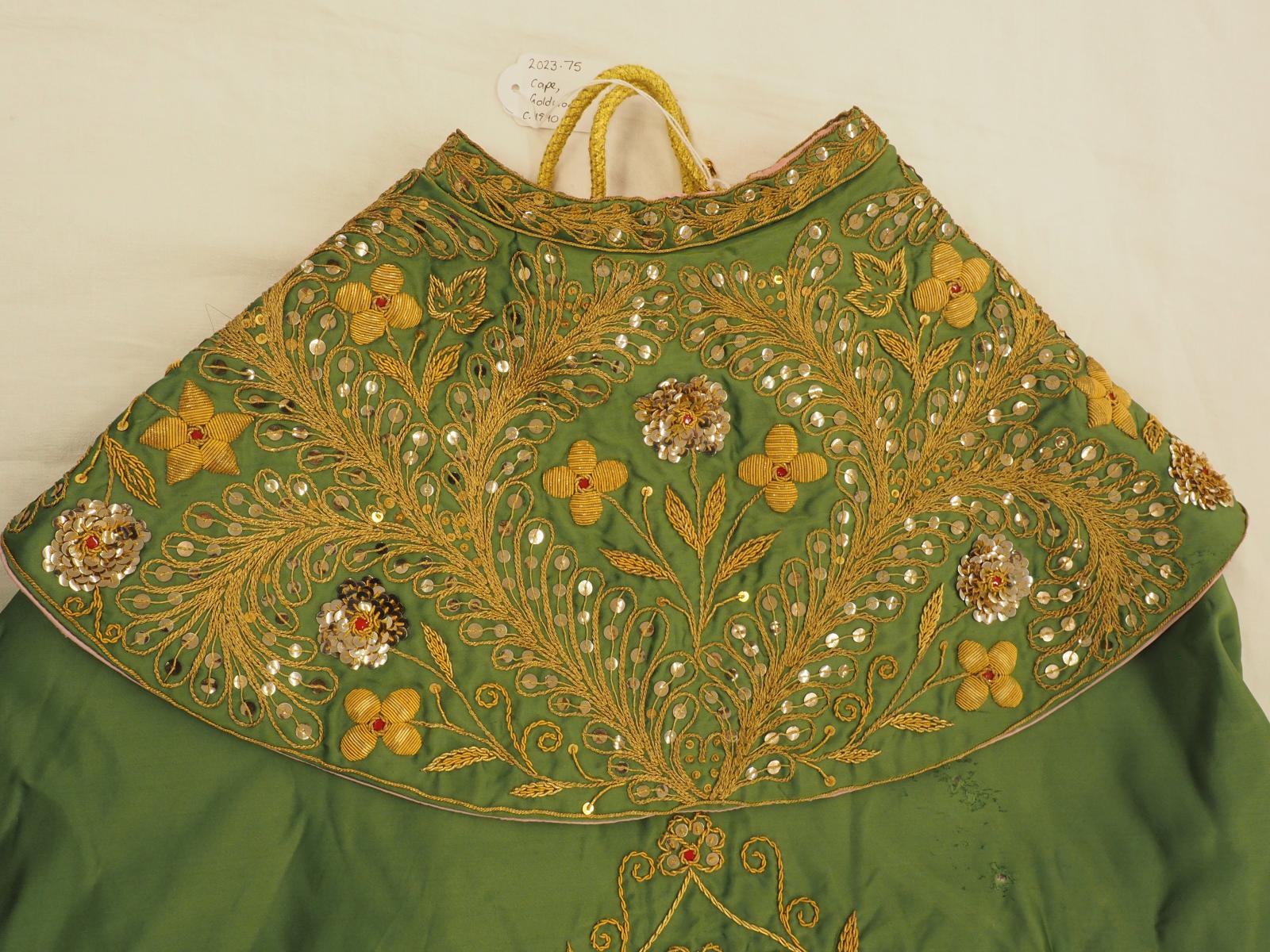 Gold work cape back collar detail