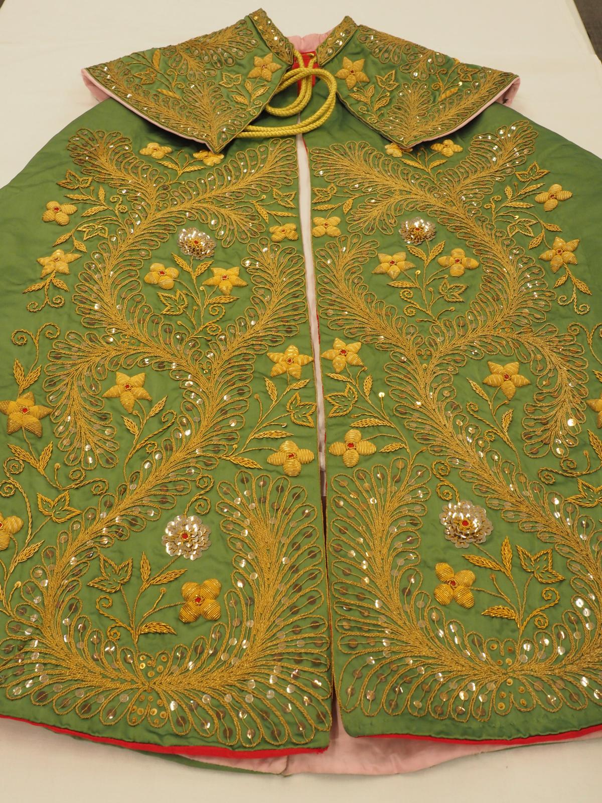 Gold work cape front detail