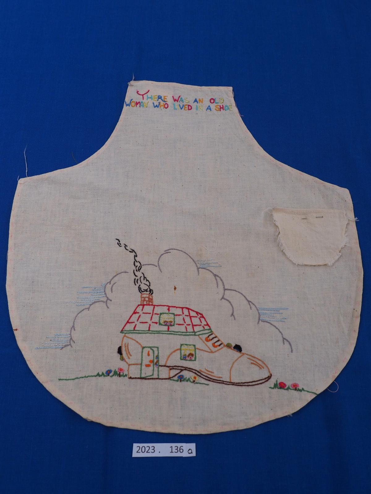 Child's apron of Old Mother Hubbard