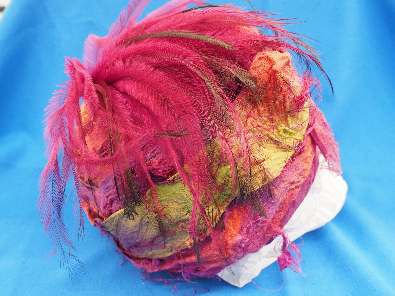 Machine embroidered hat of silk felt side
