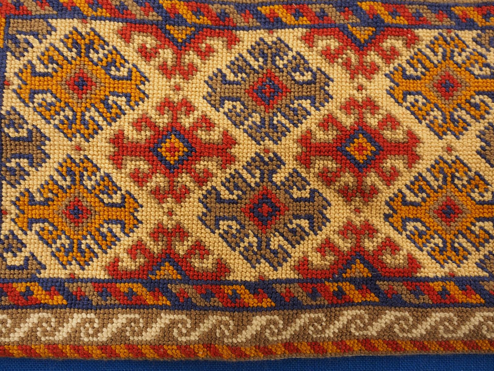 Miniature embroidered rug detail