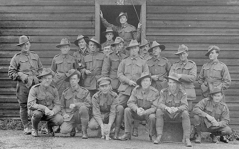 Recruits in front of camp hut