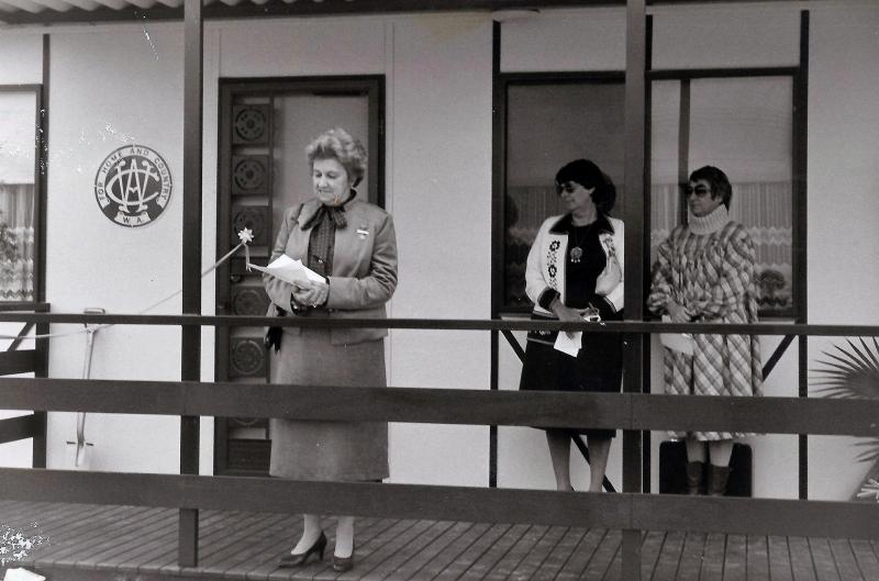 black and white photo of a woman giving a speech