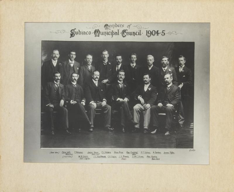 black and white photograph of 15 men