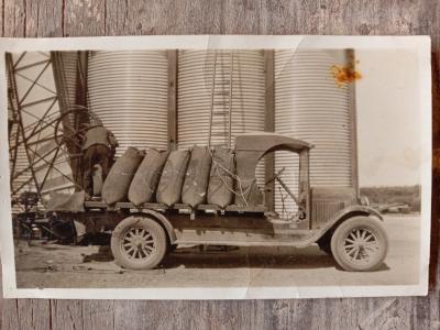 A photo of a truck at the Manmanning wheat bin, 1930s.