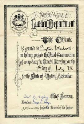 cream paper certificate with black writing and crest in top left corner