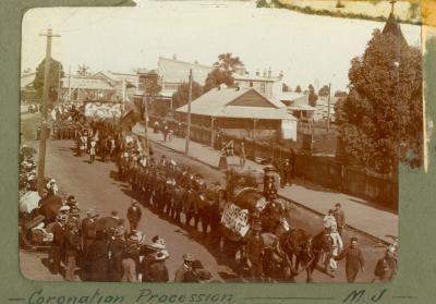 P100-01. Coronation procession moving east along Newcastle Road (Great Northern Highway).