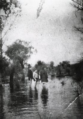 Three children playing in the flooded Southern River