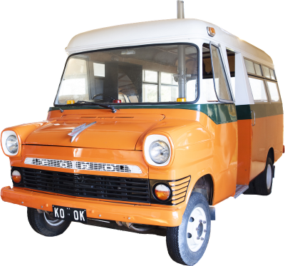 an orange, green and white school bus