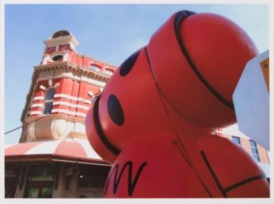 Digital print depicting view of A.E Davies building on corner of Market and Bannister Streets with a blow-up Nova radio station mascot in the foreground