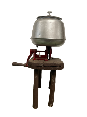 Sunrise Butter Churn mounted on wooden milking stool