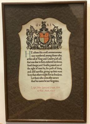 Rectangular frame with brown mat and central cream scroll with British Coat of Arms and dedication to J.L. Groat