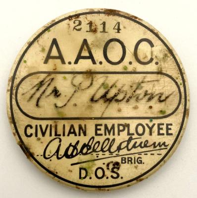 'A.A.O.C. Civilian Employee' badge named to Mr. P. Upton