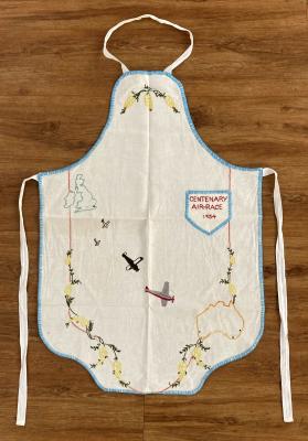 Hand-embroidered apron commemorating the Centenary Air Race in 1934