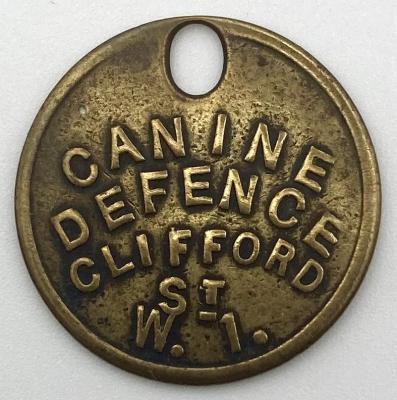 'Canine Defence' dog tag - front