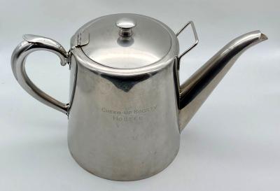 Cheer-Up Society Hostel teapot from front, showing inscription