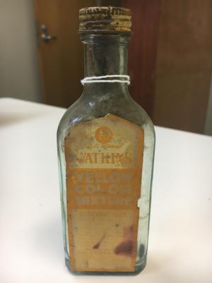 Bottle of yellow colour mixture