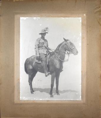 Black and white photographic postcard of Trooper Henry RISEBOROUGH on his mount ‘Gus’