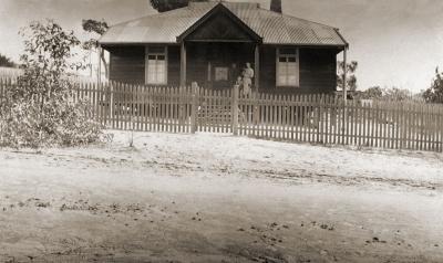Weatherboard House With Picket Fence