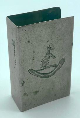 Metal matchbox cover featuring engraving of a kangaroo on a boomerang