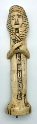 Carved camel bone in the form of an Egyptian shabti
